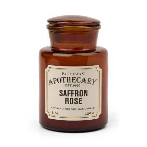 Αρωματικό κερί σόγιας Paddywax Apothecary Saffron Rose 226g σε κεχριμπαρένιο γυάλινο βάζο φαρμακείου.